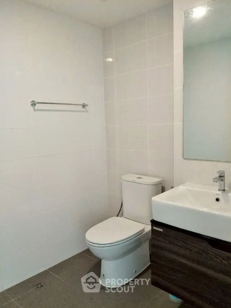 Modern bathroom with sleek fixtures and minimalist design.