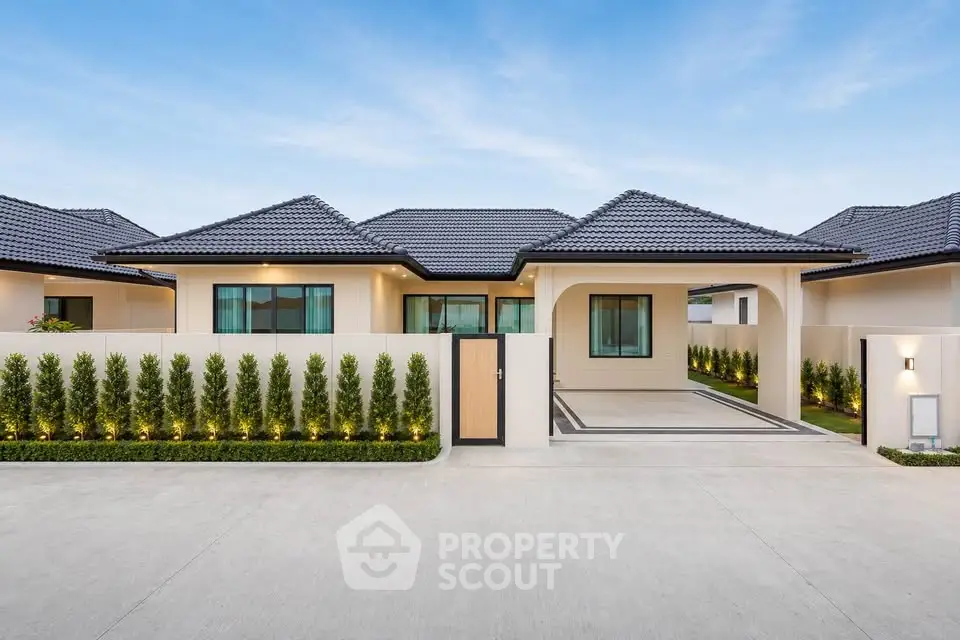 Modern single-story house with elegant facade and landscaped garden