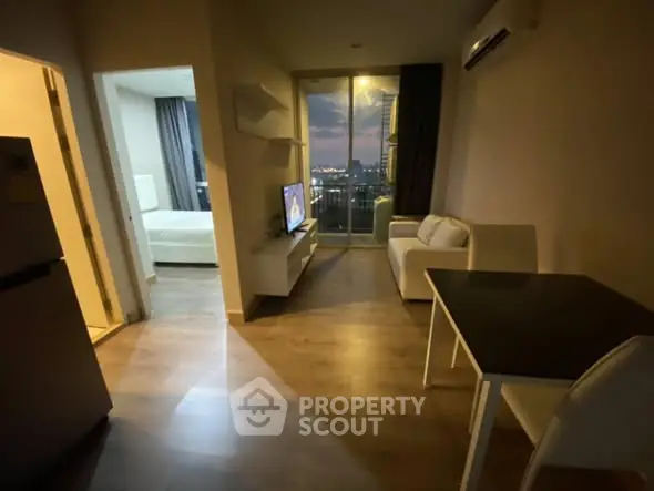 Modern apartment with cozy living room and city view balcony