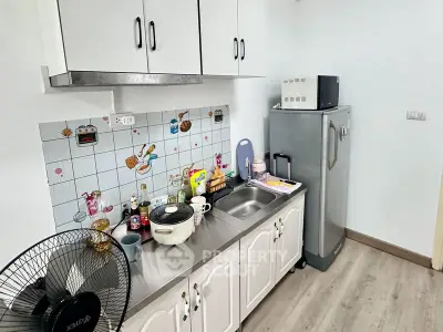 Charming kitchen with modern appliances and playful backsplash design