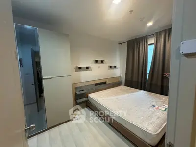 Modern bedroom with sleek design and ample storage space