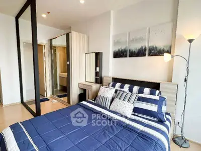Modern bedroom with stylish decor and ensuite bathroom in a contemporary apartment.