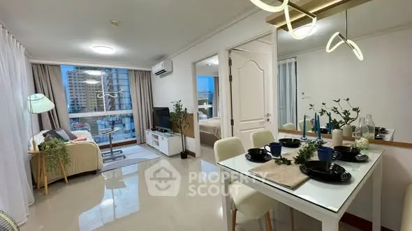 Modern open-plan living and dining area with stylish decor and city view.