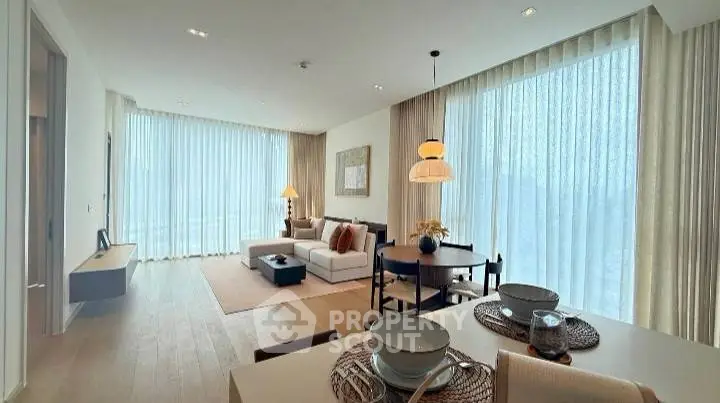 Spacious modern living room with elegant dining area and large windows