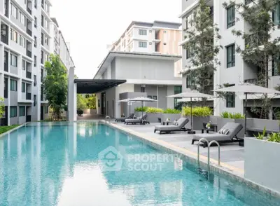 Luxurious apartment complex with a pristine swimming pool and modern amenities.