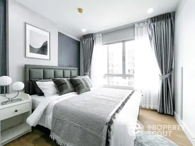 Modern bedroom with elegant decor, large window, and stylish curtains in a bright apartment.