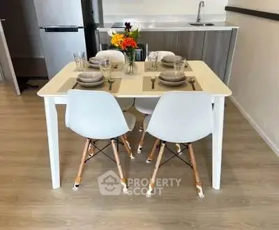 Modern dining area with stylish table and chairs in a contemporary kitchen setting.