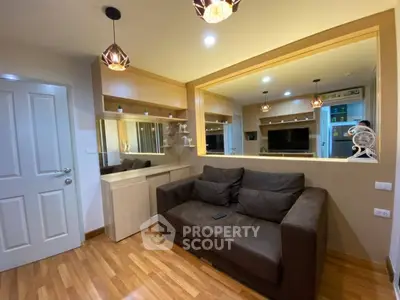 Modern living room with stylish lighting and cozy brown sofa