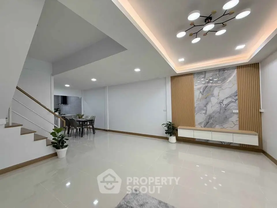 Spacious modern living room with elegant lighting and stylish decor
