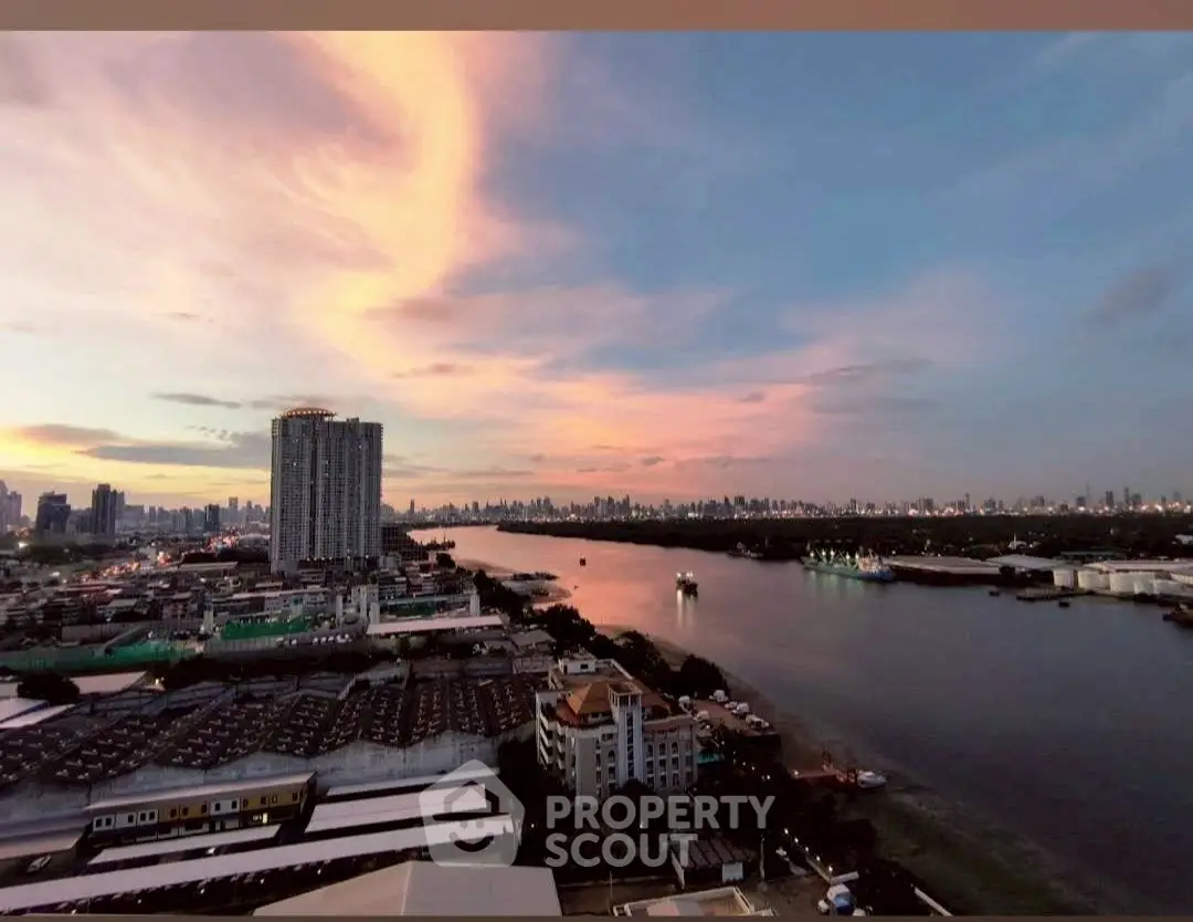 Stunning river view with city skyline at sunset, perfect for urban living enthusiasts.