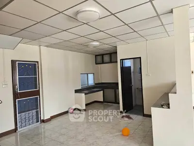Spacious interior with tiled flooring and modern kitchen layout