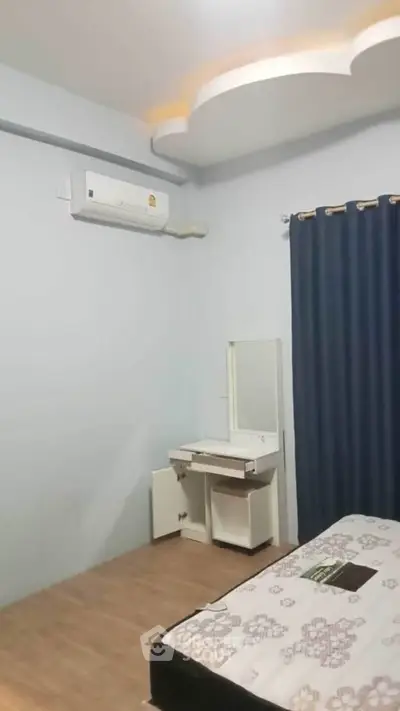 Cozy bedroom with air conditioning and modern ceiling design