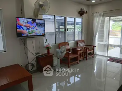 Spacious living room with modern decor and natural light