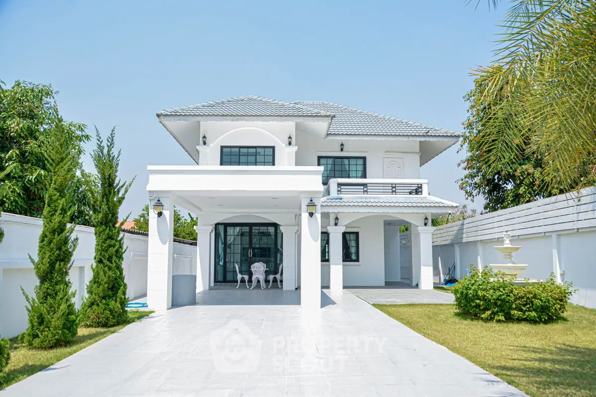 Stunning modern two-story house with spacious driveway and lush garden