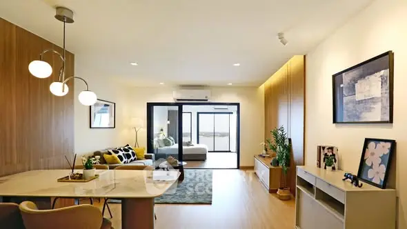 Modern living room with stylish decor and open layout, featuring elegant lighting and cozy seating area.