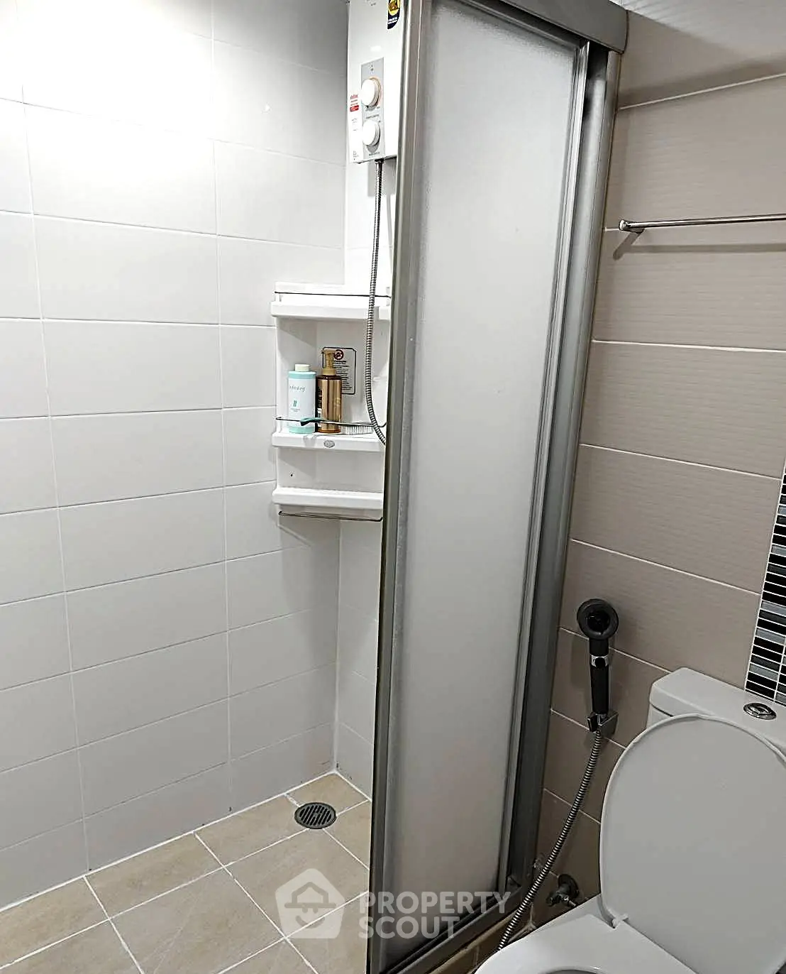 Modern bathroom with shower and toilet in sleek minimalist design