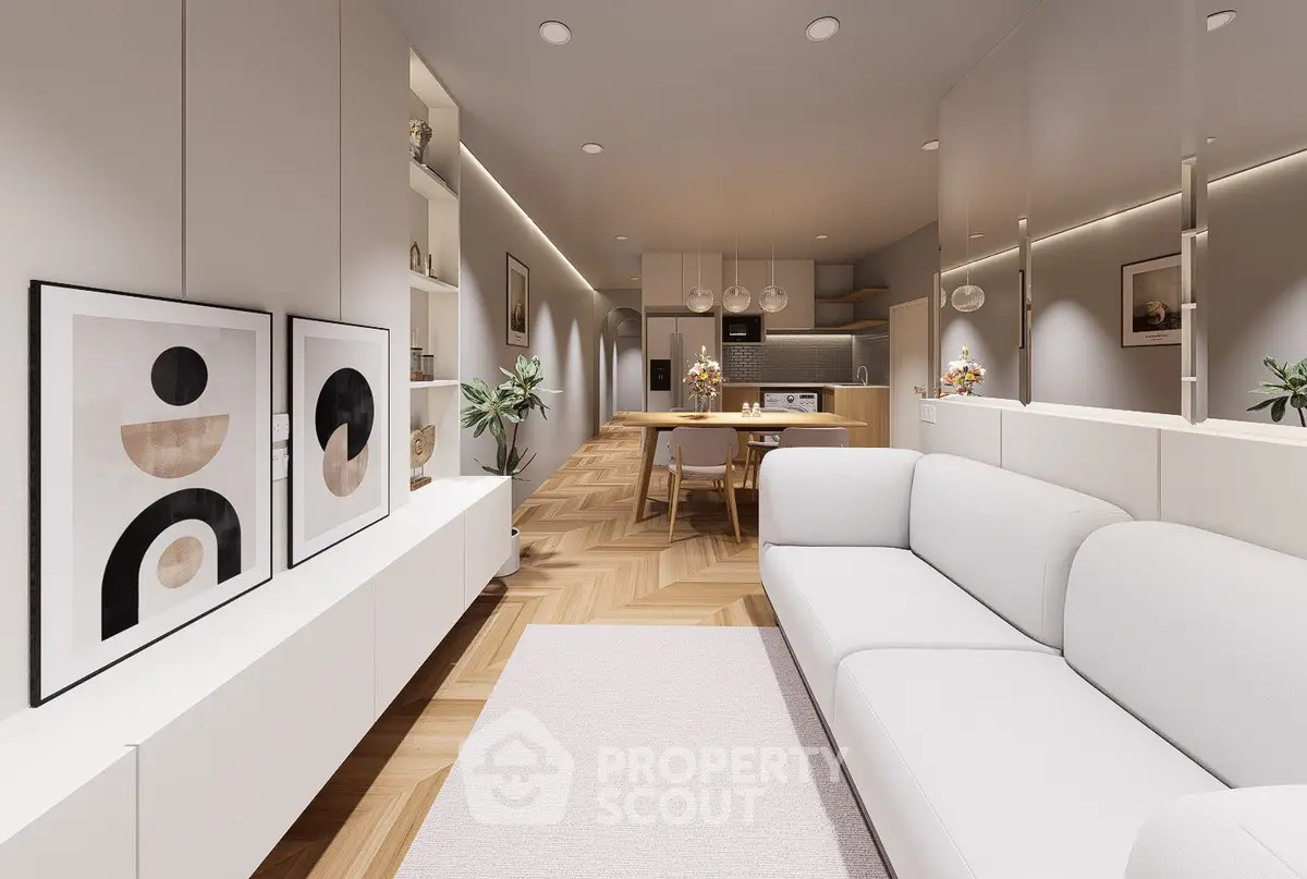Modern open-plan living room with stylish decor and kitchen area