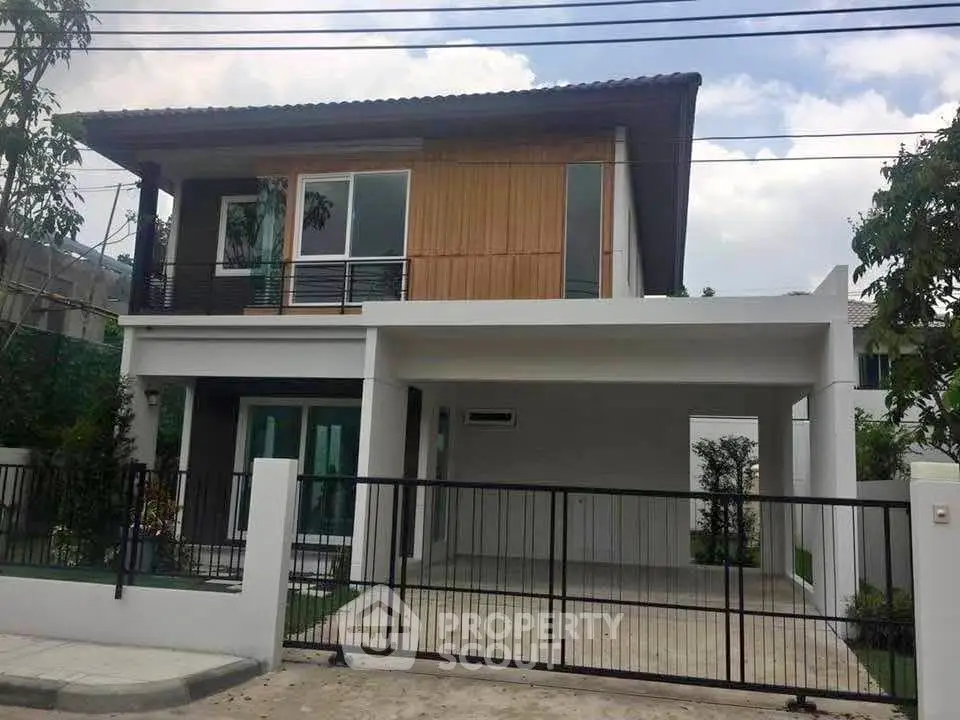 Modern two-story house with sleek design and spacious driveway