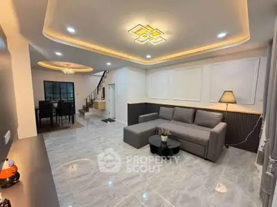 Spacious modern living room with elegant lighting and stylish decor