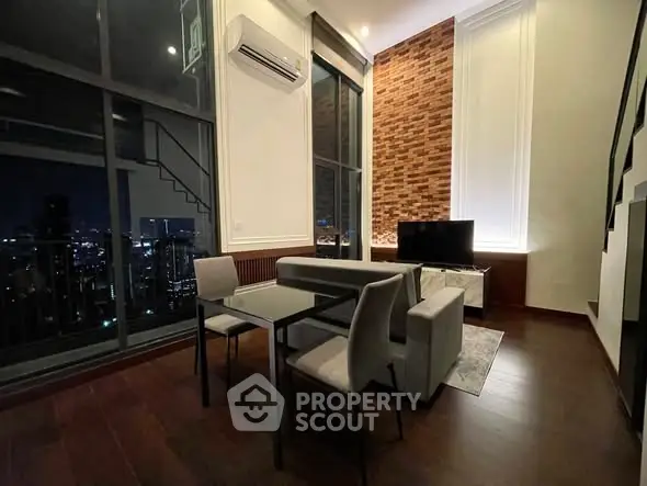 Modern living room with city view and stylish brick accent wall