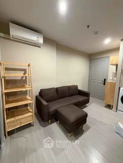 Modern living room with brown sofa and wooden shelves in cozy apartment