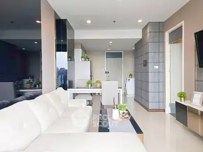 Modern living room with sleek furniture and open layout in a stylish apartment.