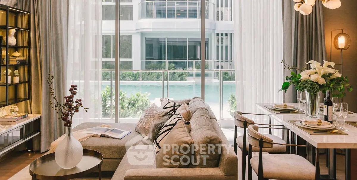 Luxurious living room with pool view, elegant decor, and modern furnishings.