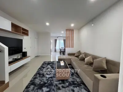 Spacious modern living room with plush sectional sofa and stylish decor
