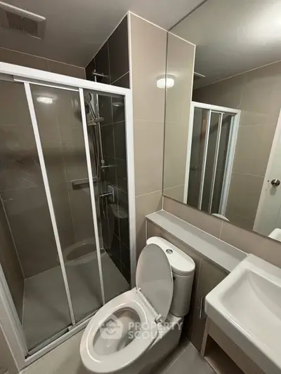 Modern bathroom with shower enclosure and sleek fixtures