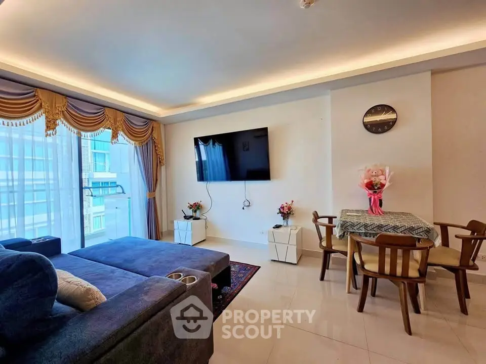Spacious living room with modern decor and large window view