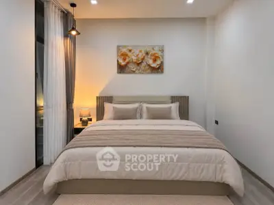 Cozy bedroom with elegant decor and soft lighting, perfect for relaxation.
