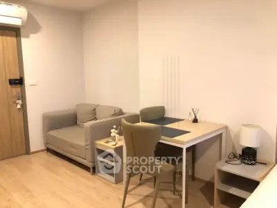 Cozy modern living room with stylish furniture and wooden flooring, perfect for urban living.