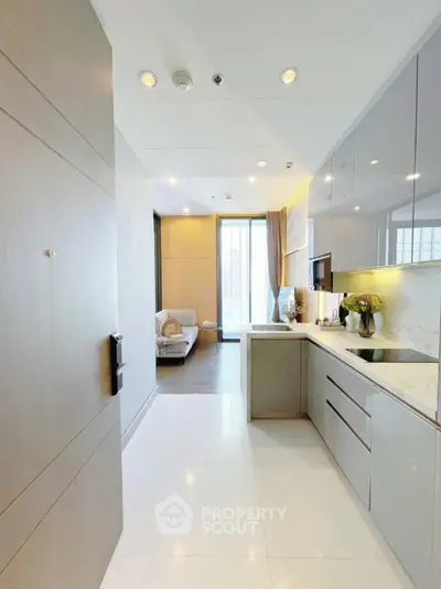 Modern open-layout kitchen with sleek design and bright living area view.