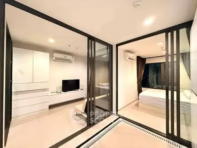 Modern apartment with glass partitions, sleek furniture, and air conditioning units.