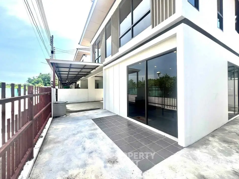 Modern two-story home with sleek design and spacious outdoor area.