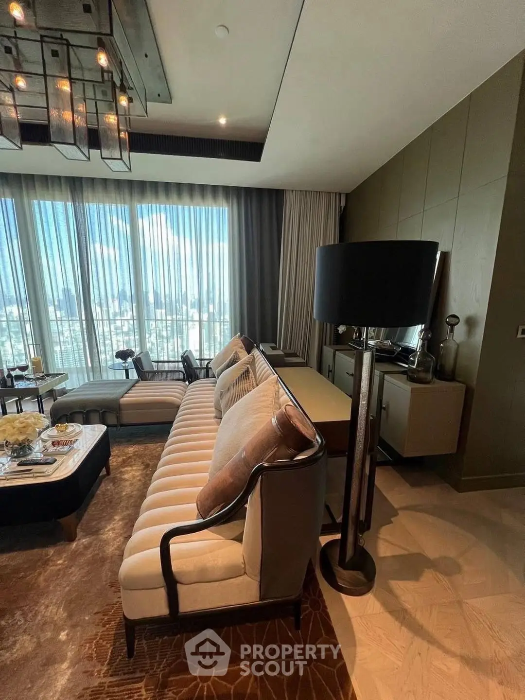 Luxurious living room with elegant decor and panoramic city view.