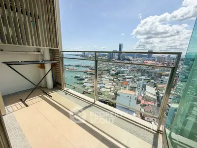 Stunning high-rise balcony with panoramic city and ocean views