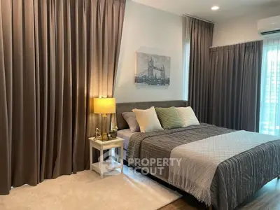 Cozy bedroom with elegant curtains and stylish decor in modern apartment