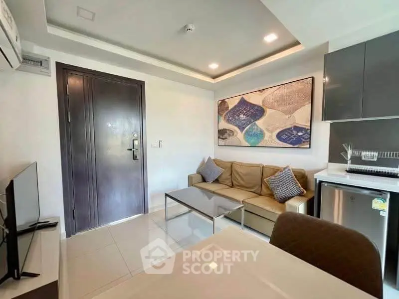 Modern living room with sleek furniture and stylish decor in a contemporary apartment.