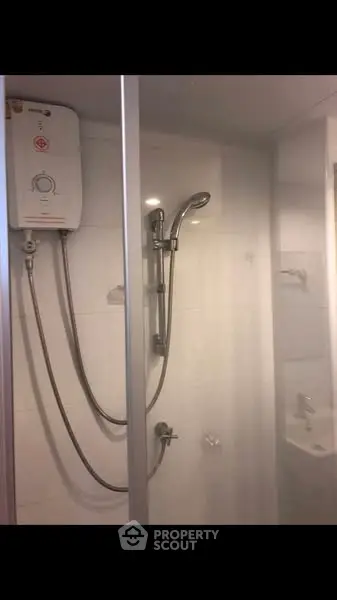 Modern bathroom with shower and water heater in sleek design
