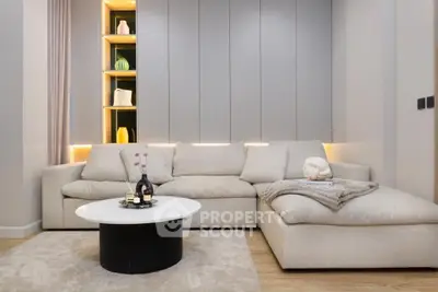 Modern living room with stylish beige sofa and elegant decor