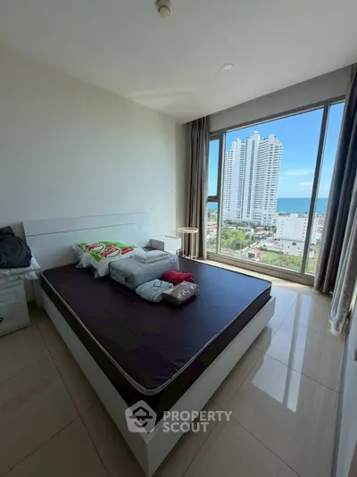 Spacious bedroom with stunning city view and modern furnishings