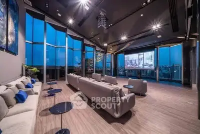 Luxurious modern living room with panoramic city views and elegant furnishings.