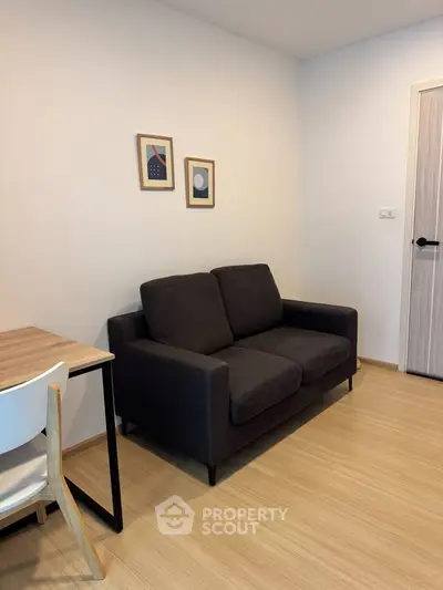 Cozy living room with modern sofa and stylish decor in a contemporary apartment.