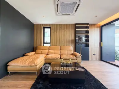 Modern living room with leather sofa and sleek wooden accents