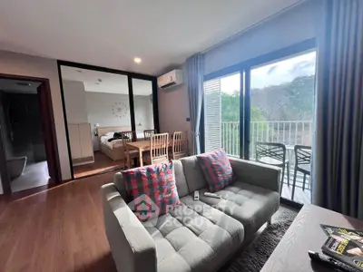 Modern living room with balcony access and stylish decor