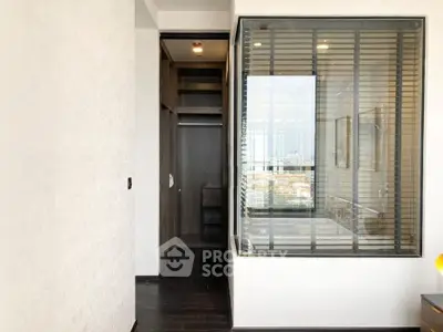 Modern interior with glass partition and walk-in closet in luxury apartment