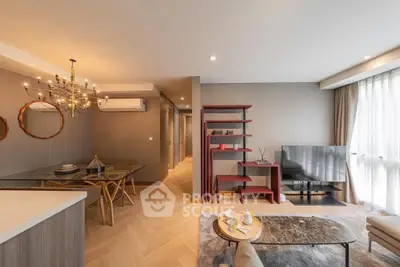 Modern living room with elegant chandelier and stylish decor