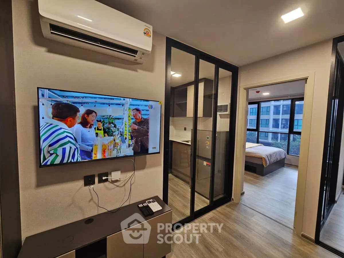 Modern apartment interior with sleek kitchen and cozy bedroom view