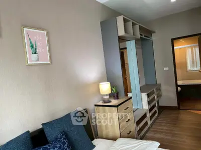 Cozy bedroom with modern decor and ample storage space